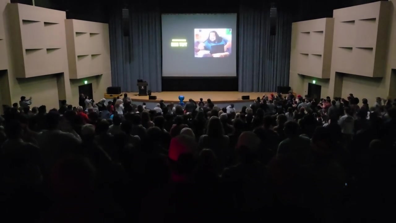 A packed OSU auditorium of students during the Skweezy Jibbs screening, seen from the crowd