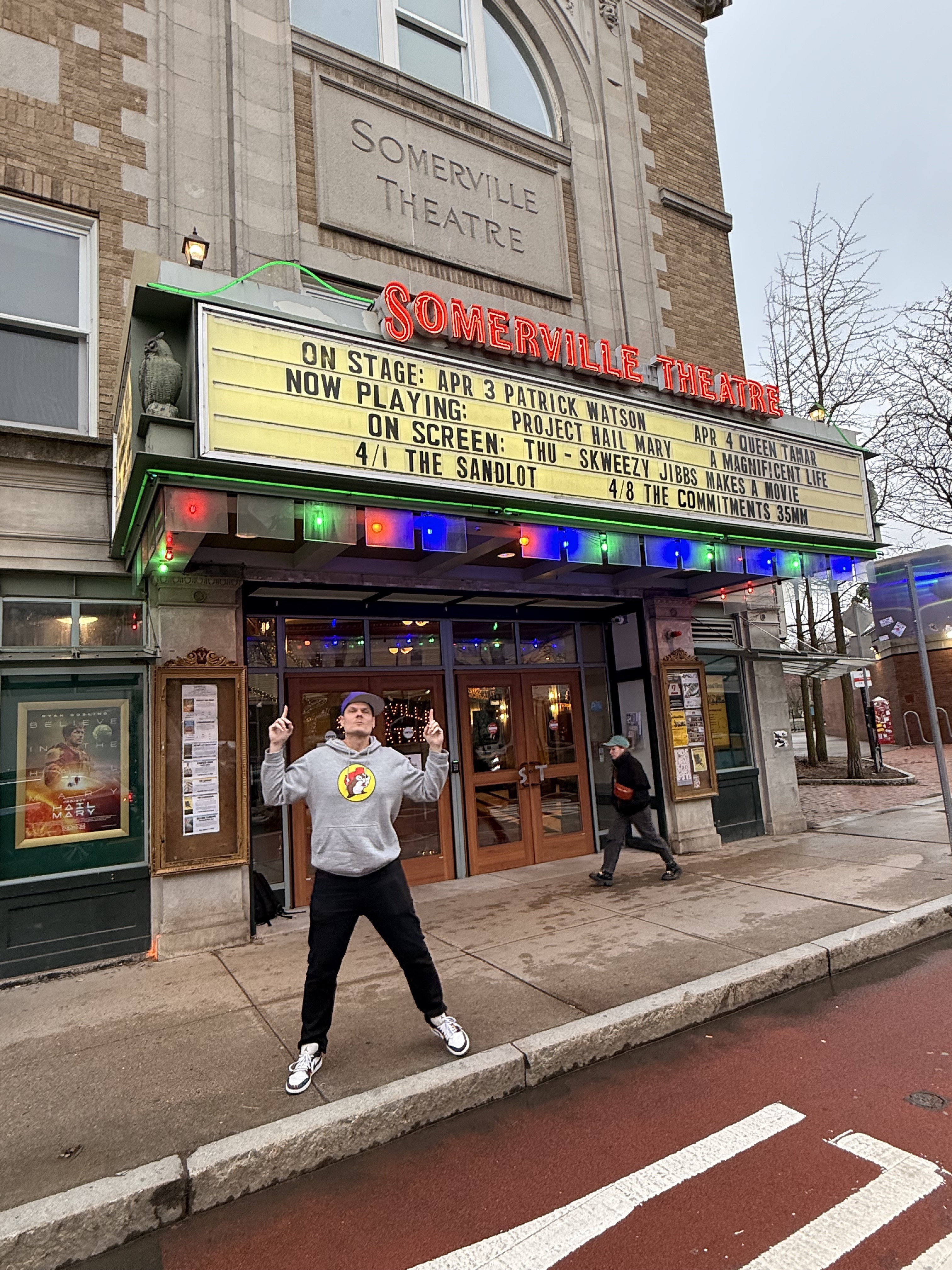 Skweezy Jibbs jumping in front of Somerville Theatre marquee